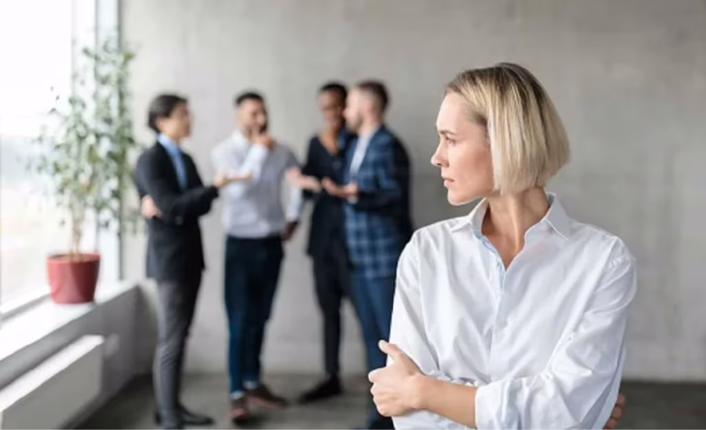 woman looking away outside of group talking